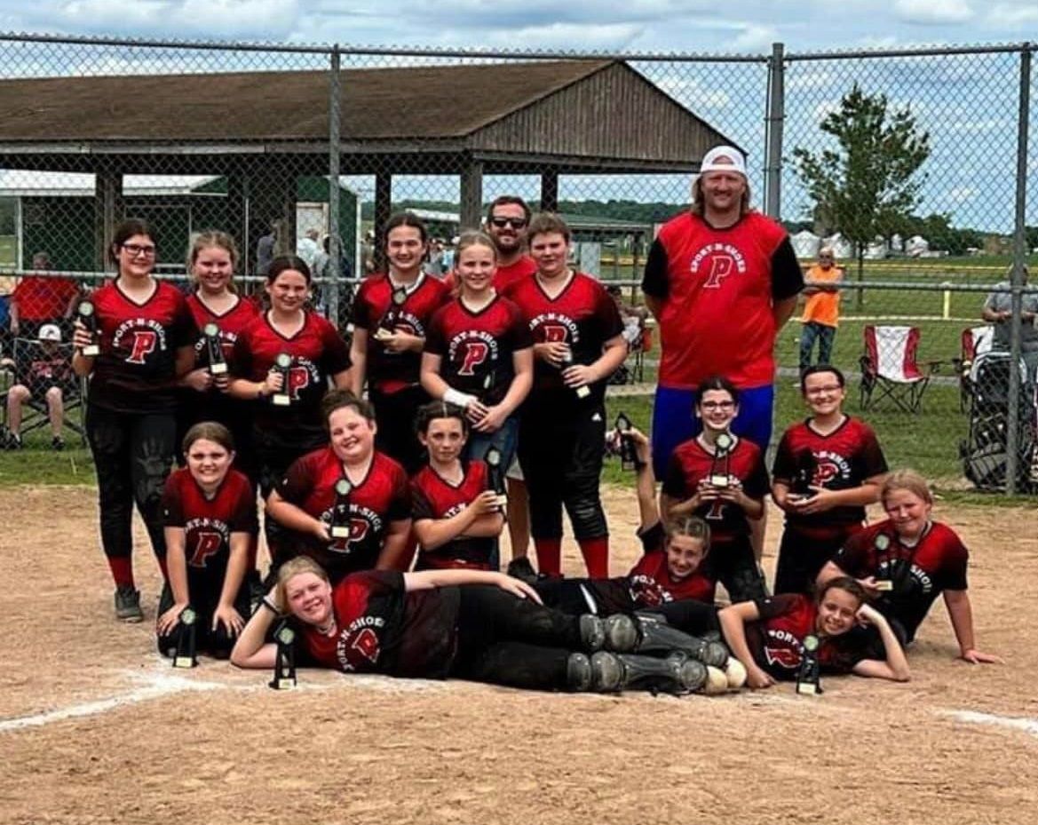 Youth softball team in custom uniforms