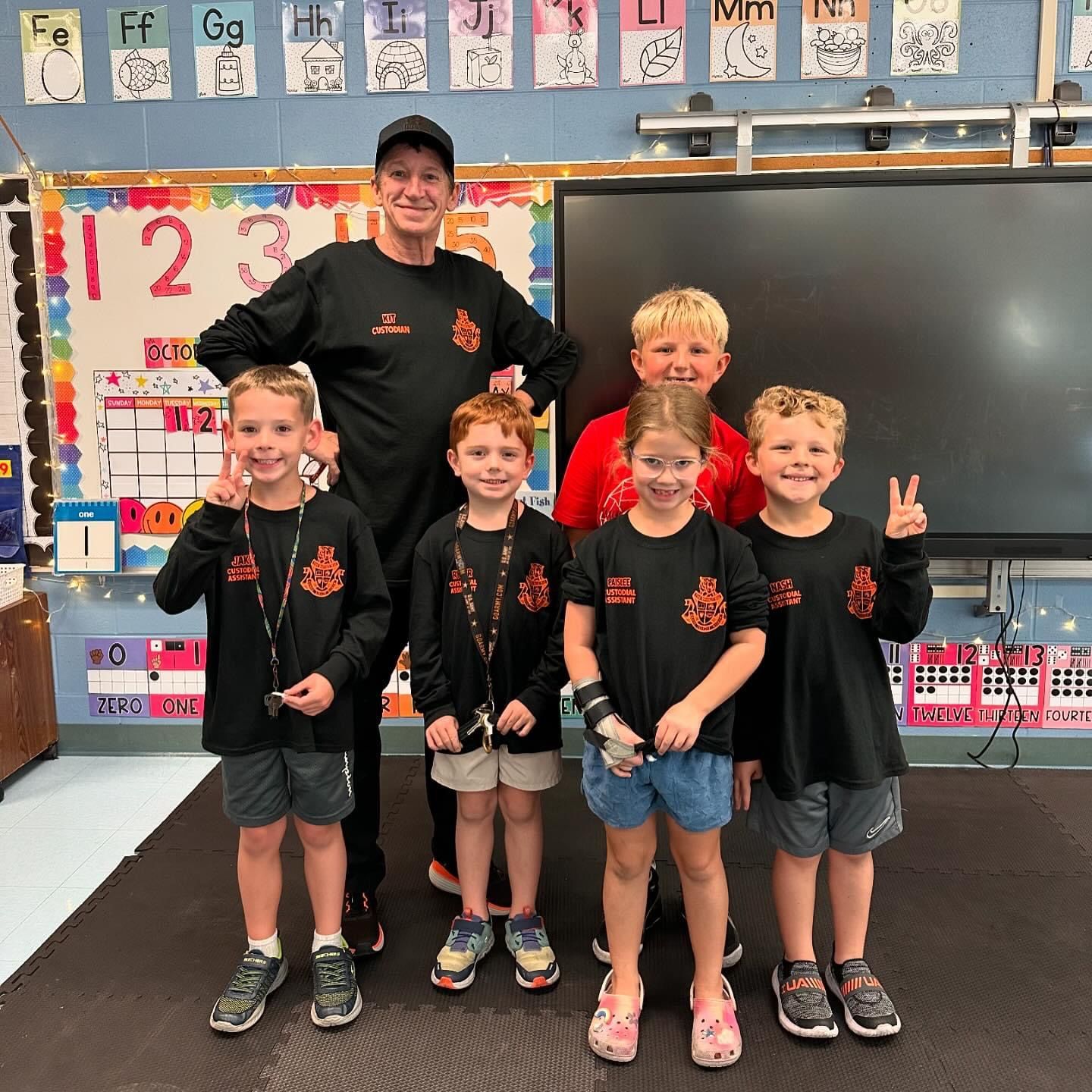 School staff and students in matching custom shirts